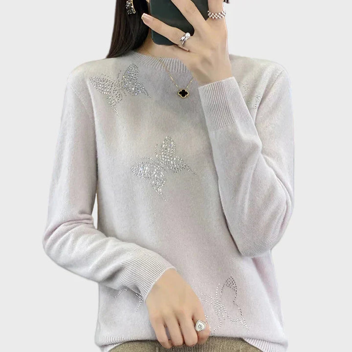 Cuello vuelto de punto con diseño de mariposa
